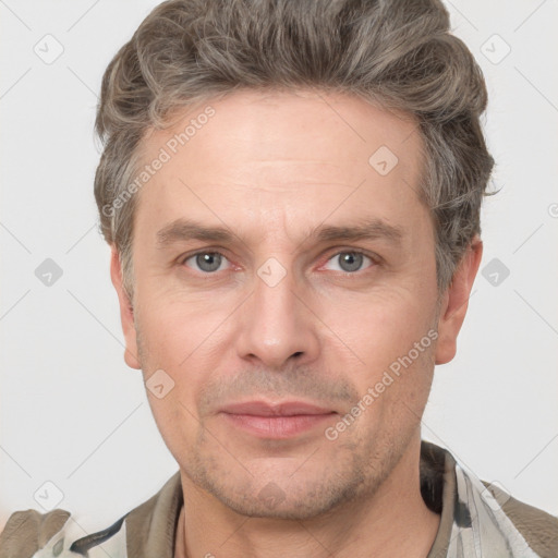 Joyful white adult male with short  brown hair and grey eyes