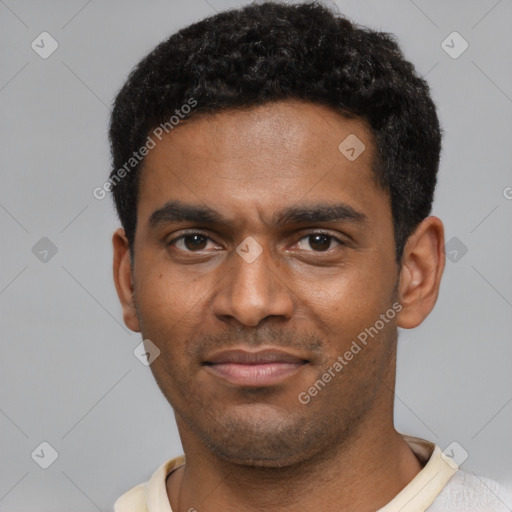 Joyful black young-adult male with short  black hair and brown eyes