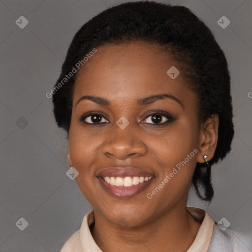 Joyful black young-adult female with medium  black hair and brown eyes