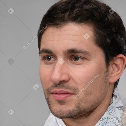 Joyful white adult male with short  brown hair and brown eyes