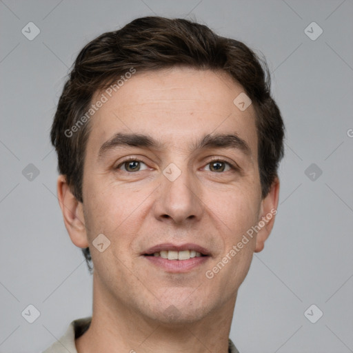 Joyful white young-adult male with short  brown hair and grey eyes