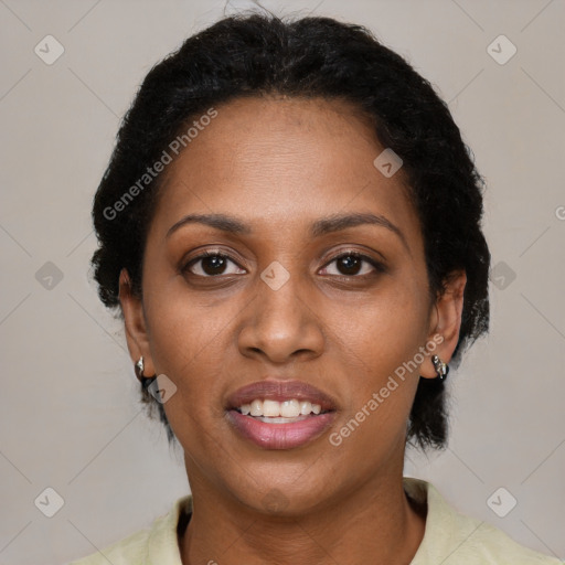 Joyful black young-adult female with short  black hair and brown eyes