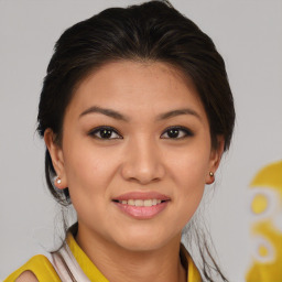 Joyful asian young-adult female with medium  brown hair and brown eyes
