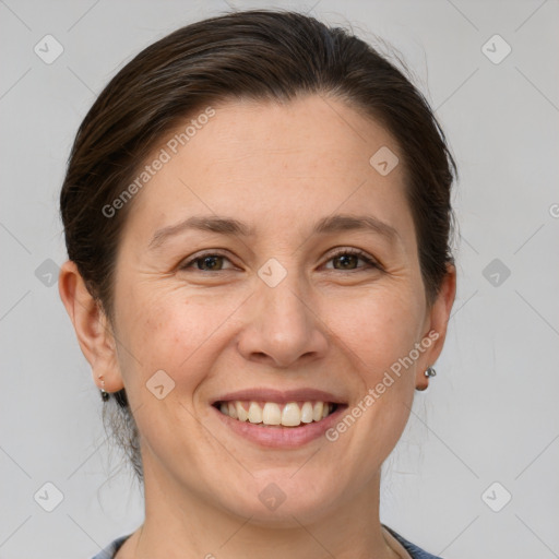 Joyful white adult female with medium  brown hair and grey eyes