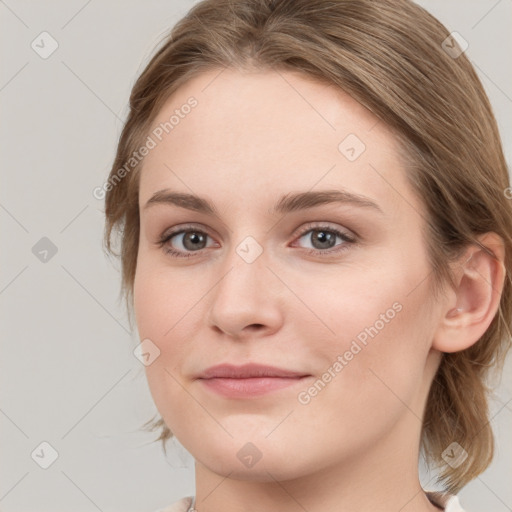 Joyful white young-adult female with medium  brown hair and blue eyes