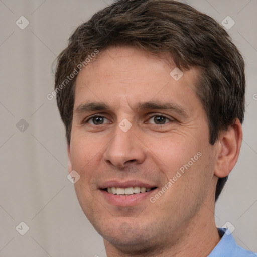 Joyful white adult male with short  brown hair and brown eyes