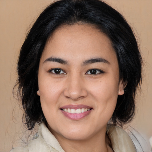 Joyful white young-adult female with medium  brown hair and brown eyes