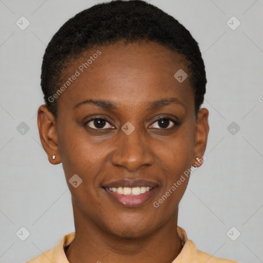 Joyful black young-adult female with short  black hair and brown eyes