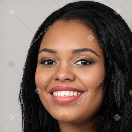 Joyful latino young-adult female with long  black hair and brown eyes