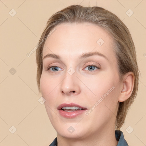 Joyful white young-adult female with medium  brown hair and blue eyes