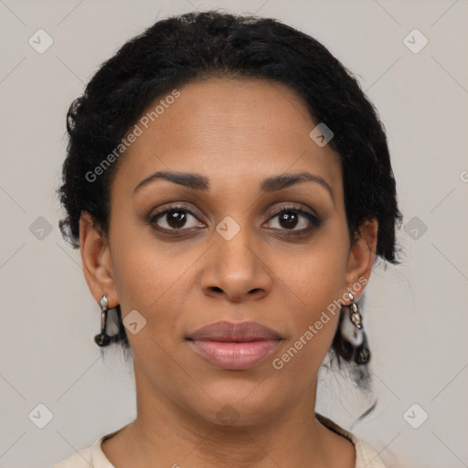 Joyful black young-adult female with medium  brown hair and brown eyes