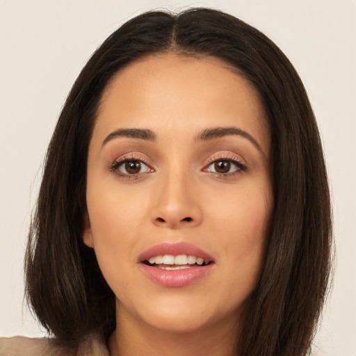 Joyful white young-adult female with long  brown hair and brown eyes