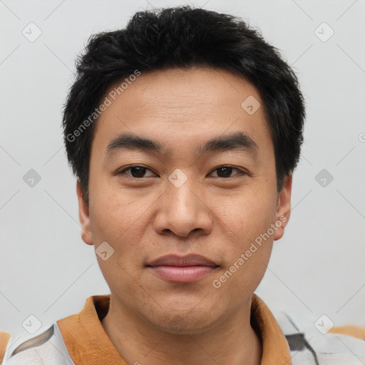 Joyful asian young-adult male with short  brown hair and brown eyes