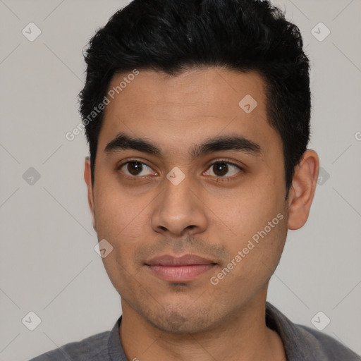 Joyful latino young-adult male with short  black hair and brown eyes