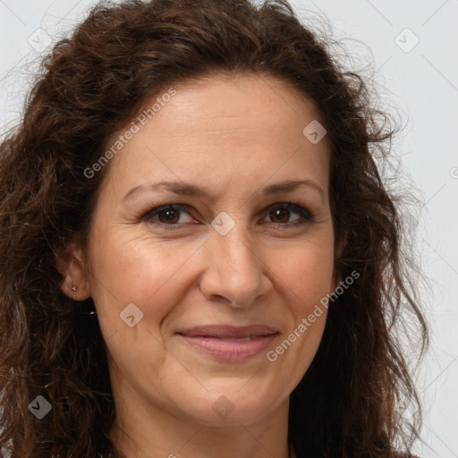 Joyful white adult female with long  brown hair and brown eyes