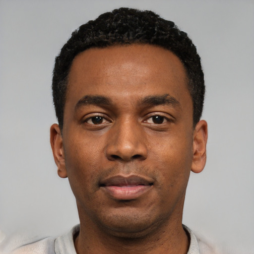 Neutral black young-adult male with short  black hair and brown eyes