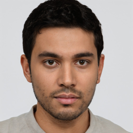 Neutral latino young-adult male with short  black hair and brown eyes