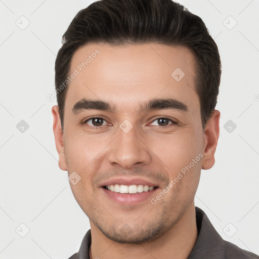 Joyful white young-adult male with short  brown hair and brown eyes