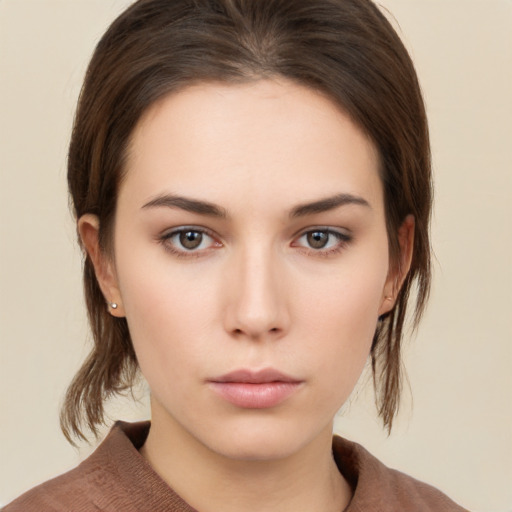 Neutral white young-adult female with medium  brown hair and brown eyes