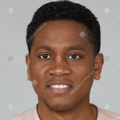 Joyful black young-adult male with short  brown hair and brown eyes