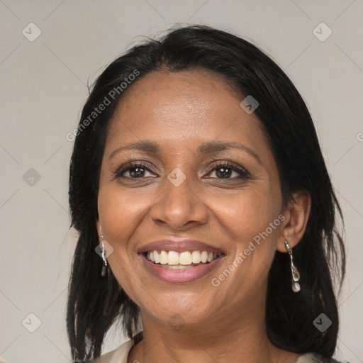 Joyful black adult female with medium  black hair and brown eyes