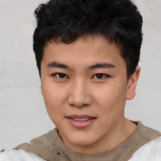 Joyful asian young-adult male with short  brown hair and brown eyes