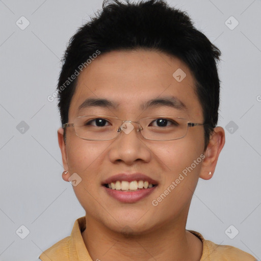 Joyful asian young-adult male with short  brown hair and brown eyes