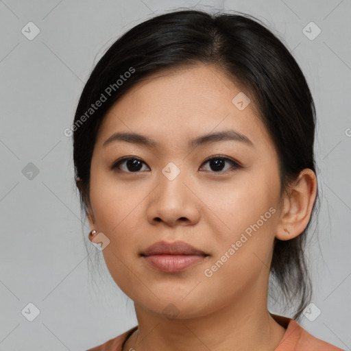 Joyful asian young-adult female with medium  black hair and brown eyes