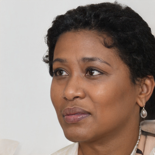 Neutral black young-adult female with short  black hair and brown eyes