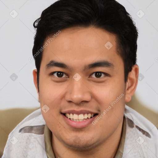 Joyful latino young-adult male with short  brown hair and brown eyes