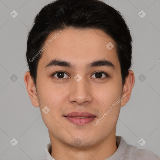 Joyful asian young-adult male with short  brown hair and brown eyes