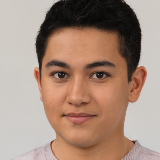 Joyful latino young-adult male with short  black hair and brown eyes