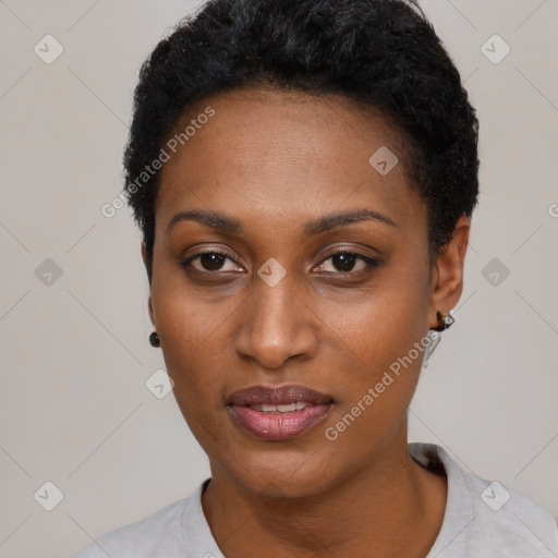 Joyful black young-adult female with short  black hair and brown eyes