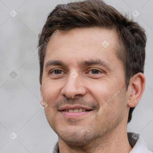 Joyful white adult male with short  brown hair and brown eyes