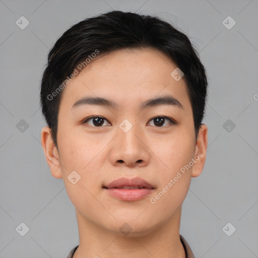 Joyful asian young-adult male with short  black hair and brown eyes