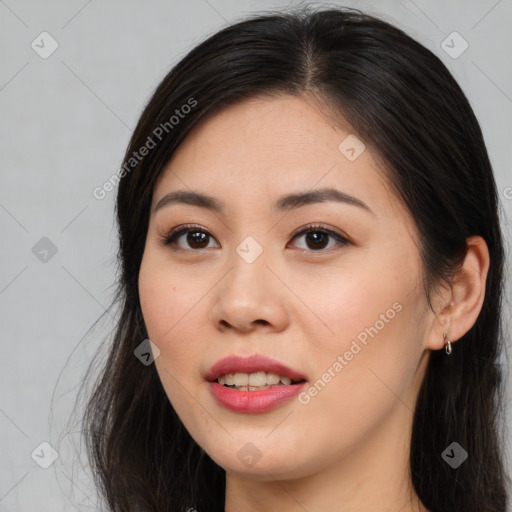 Joyful asian young-adult female with long  brown hair and brown eyes