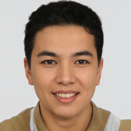 Joyful latino young-adult male with short  brown hair and brown eyes