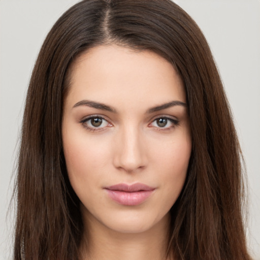 Neutral white young-adult female with long  brown hair and brown eyes