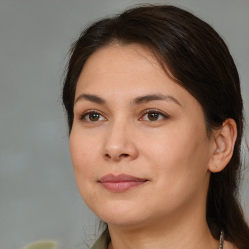 Joyful white young-adult female with medium  brown hair and brown eyes