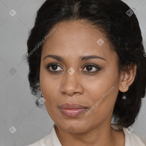 Joyful black adult female with medium  brown hair and brown eyes