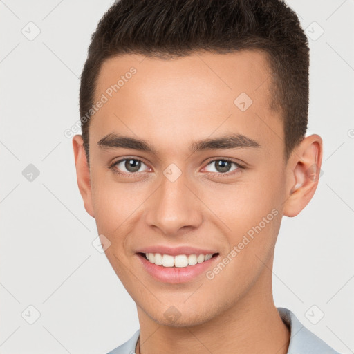 Joyful white young-adult male with short  brown hair and brown eyes