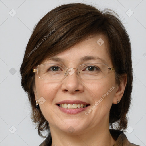 Joyful white adult female with medium  brown hair and grey eyes