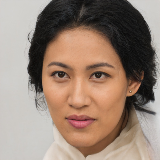 Joyful asian young-adult female with medium  brown hair and brown eyes
