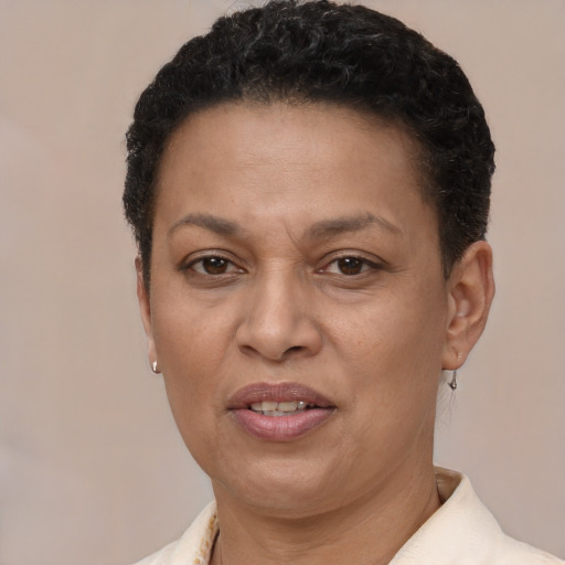 Joyful latino adult female with short  brown hair and brown eyes