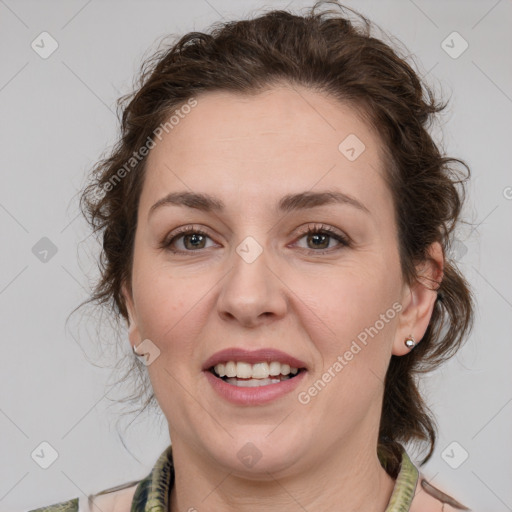 Joyful white young-adult female with medium  brown hair and green eyes