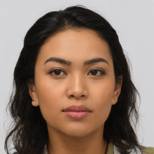 Neutral latino young-adult female with long  brown hair and brown eyes
