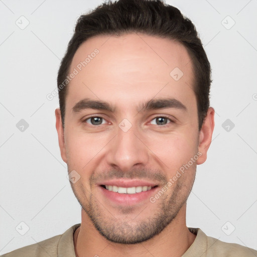 Joyful white young-adult male with short  brown hair and brown eyes