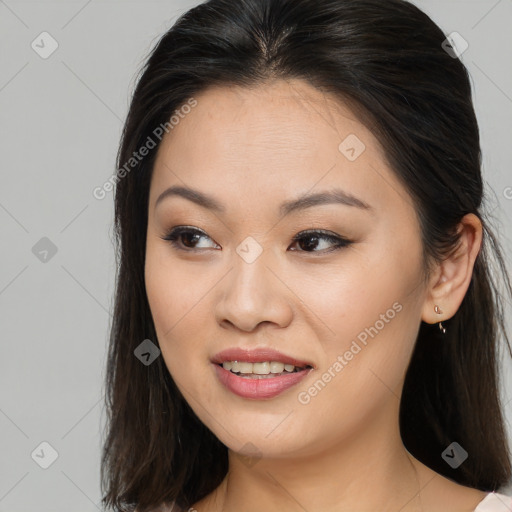 Joyful asian young-adult female with long  brown hair and brown eyes