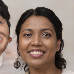 Joyful latino young-adult female with medium  black hair and brown eyes