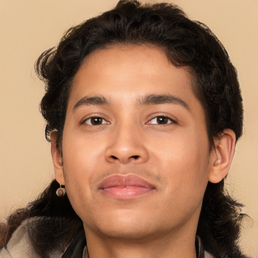 Joyful latino young-adult male with medium  brown hair and brown eyes